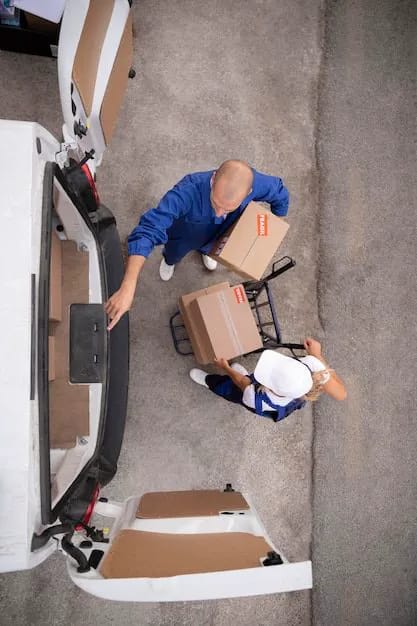 Wheat Ridge Movers professional movers loading a piano into a truck